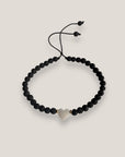 Pulsera corazón nácar con cuentas de lava negra y aros de acero oro