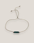 Pulsera minimal con tubo de lava verde oscuro con separadores gunmetal con cristalitos blancos