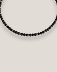 Collar mini base 4mm lava negra, rondeles plateados con cristalitos blancos
