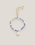 Pulsera cadena acero oro y medallita estrella nacar con cuentas de cristal azules