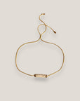 Pulsera minimal con tubo de esponja coral beis y separadores dorados con brillis de cristal blanco