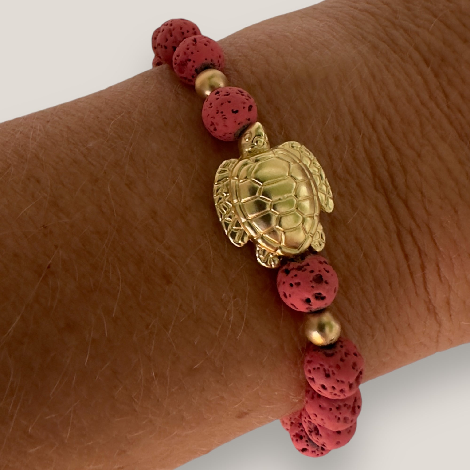 Bracelet with large golden turtle and colored lava