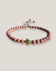 Pulsera con tortuguita dorada y lava rosa