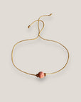 Pulsera minimal con bola 8mm de esponja coral rosa y separadores dorados con brillis de cristal rosa