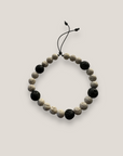 Pulsera Aventura con esponja coral beis y lava negra