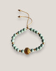 Pulsera con gran concha dorada y esponja coral verde turquesa
