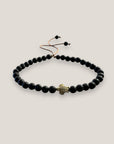 Pulsera con tortuguita dorada y lava negra