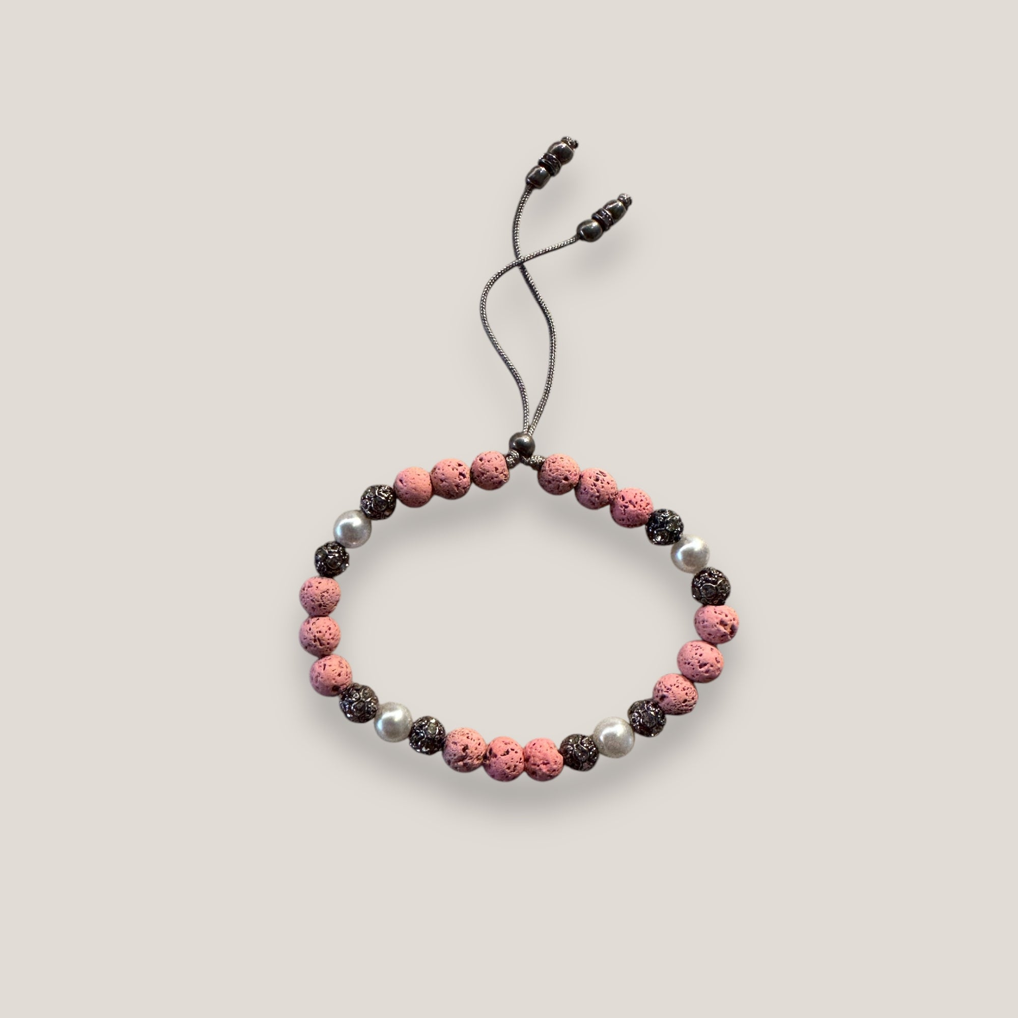 Dafne-Armband mit rosa Lavaperlen und Rotguss-Filigran mit Kristallen