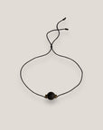 Pulsera minimal con bola 8mm de lava negra y brillis negros y oro