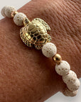 Bracelet with large golden turtle and colored lava