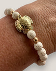 Bracelet with large golden turtle and colored lava
