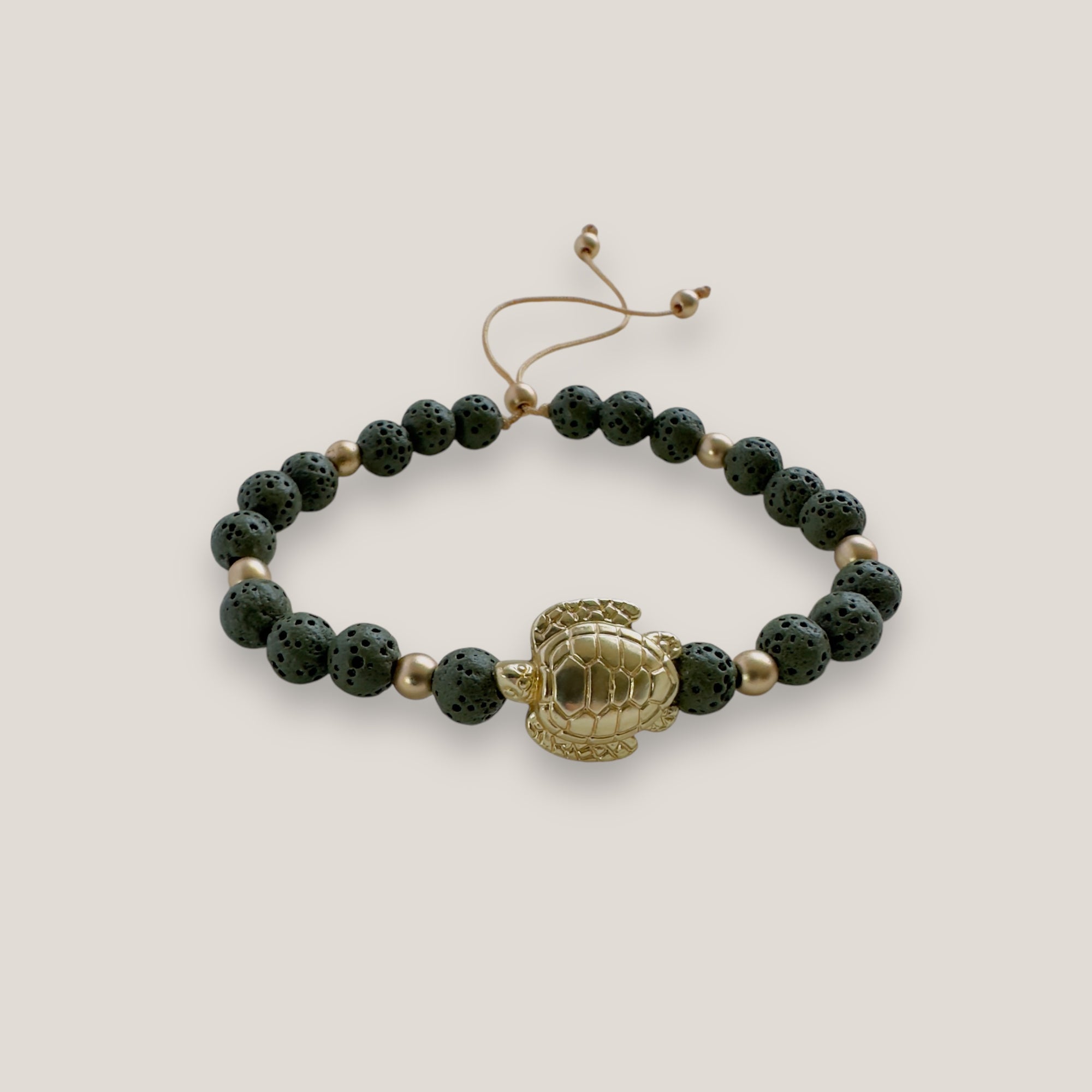Bracelet with large golden turtle and colored lava