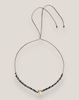 Collar Eloise con estrella howlita blanca, lava y hematitas facetadas gris metalizadas