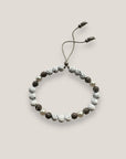 Pulsera Dafne perlas con lava blanca y filigrana gunmetal con cristalitos