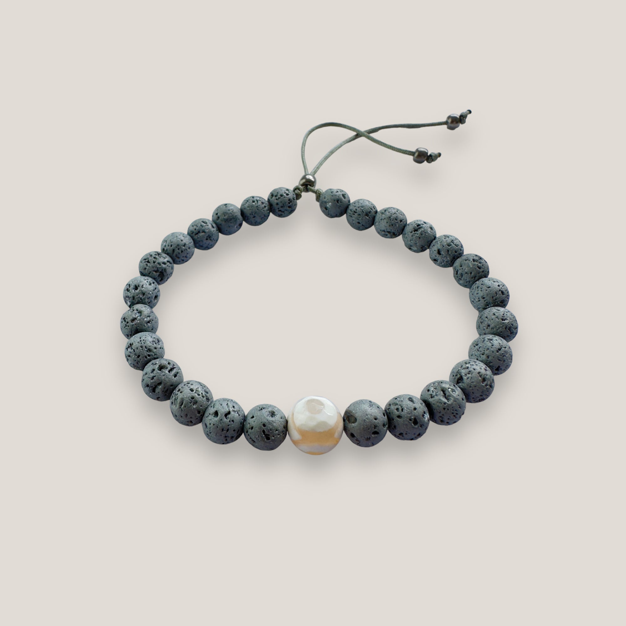 Pulsera con ojo de la suerte aborigen y lava gris claro