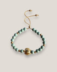 Pulsera con gran tortuga dorada y esponja coral verde turquesa