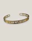 Brazalete Fuerteventura corazones acero titanio oro