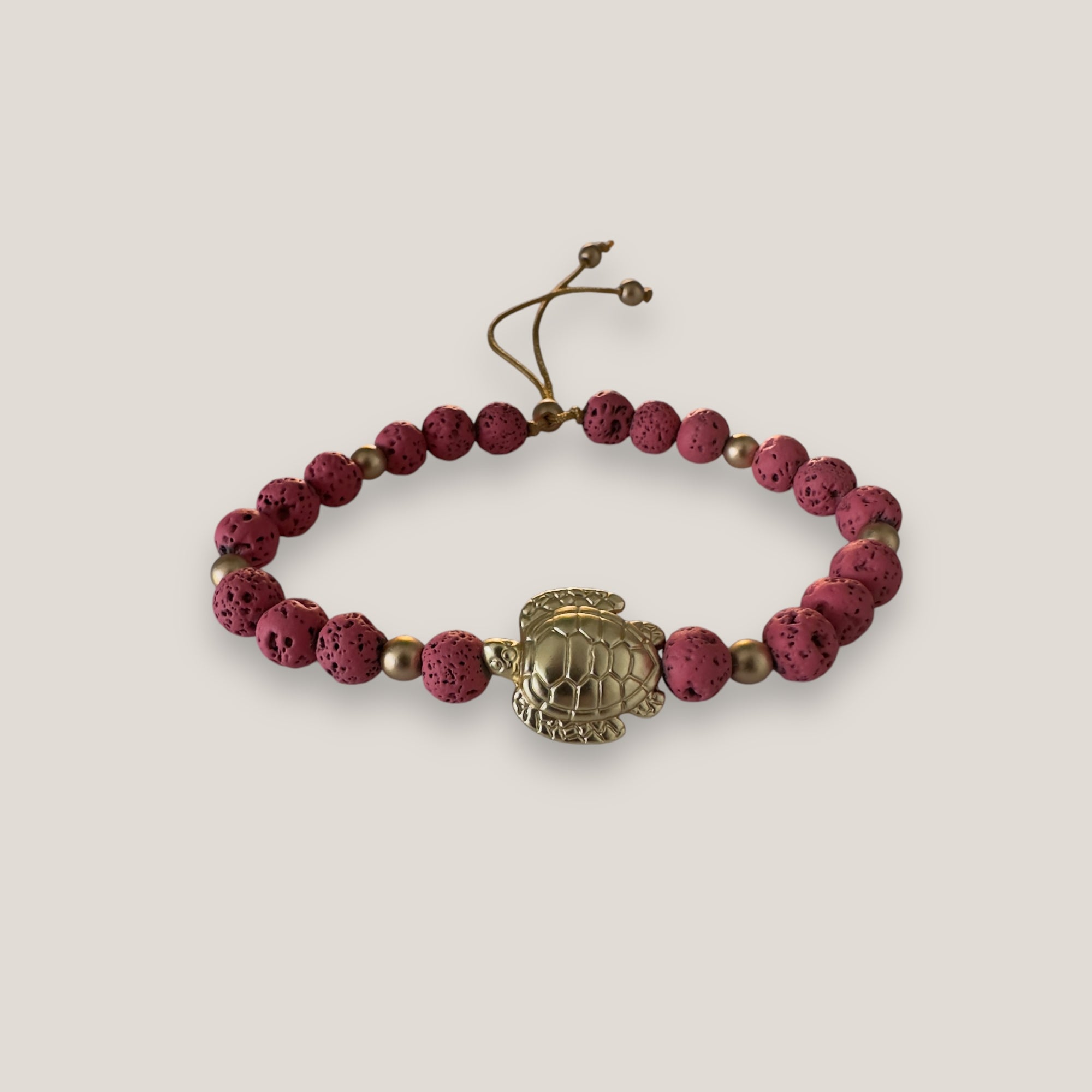 Bracelet with large golden turtle and colored lava
