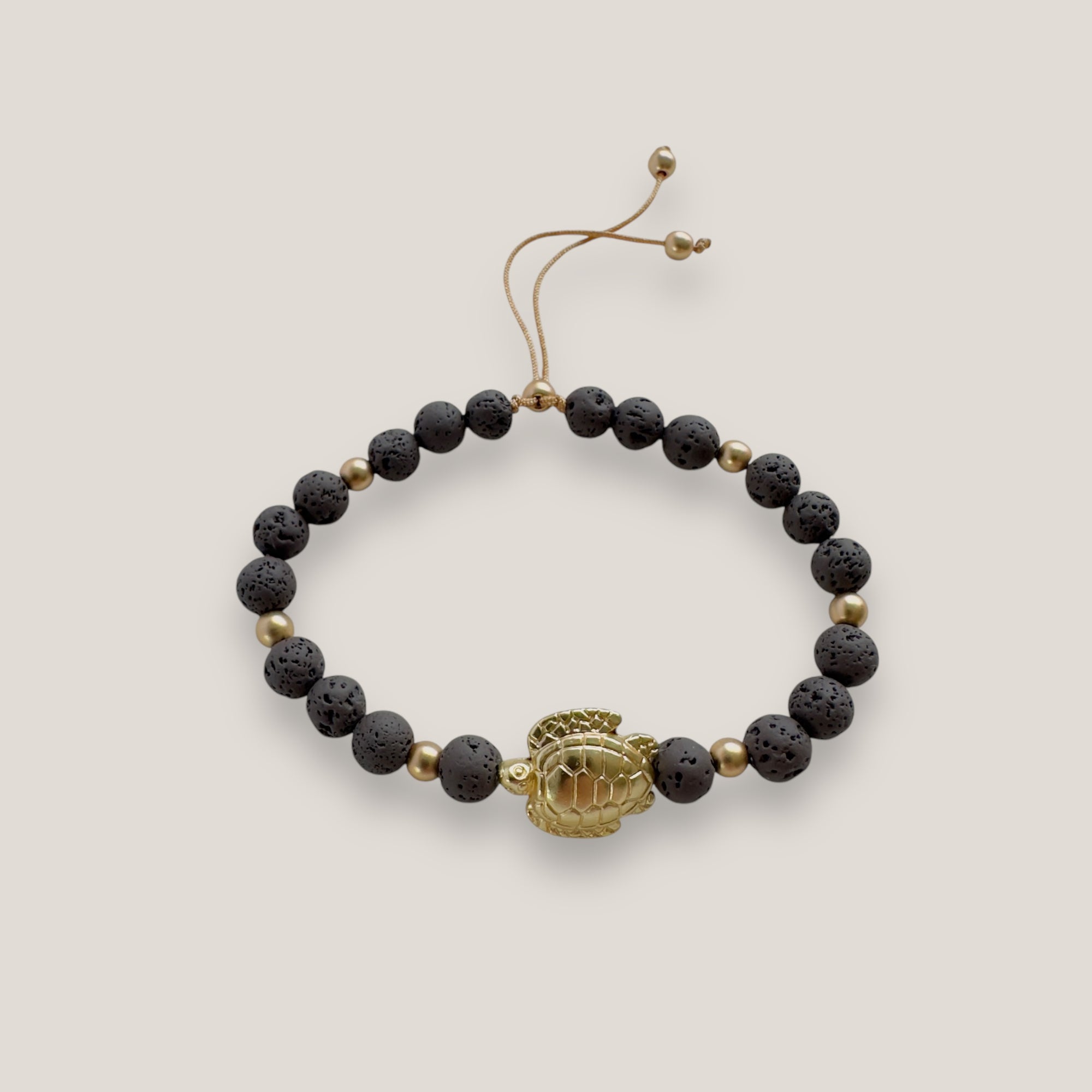 Bracelet with large golden turtle and colored lava