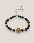 Pulsera con gran tortuga dorada y lava marrón oscuro