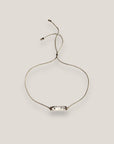 Pulsera minimal con tubo de lava blanca y cuentas plata con brillis blancos