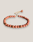 Pulsera medium base 6mm esponja coral rosa, rondeles dorados con cristalitos rosas