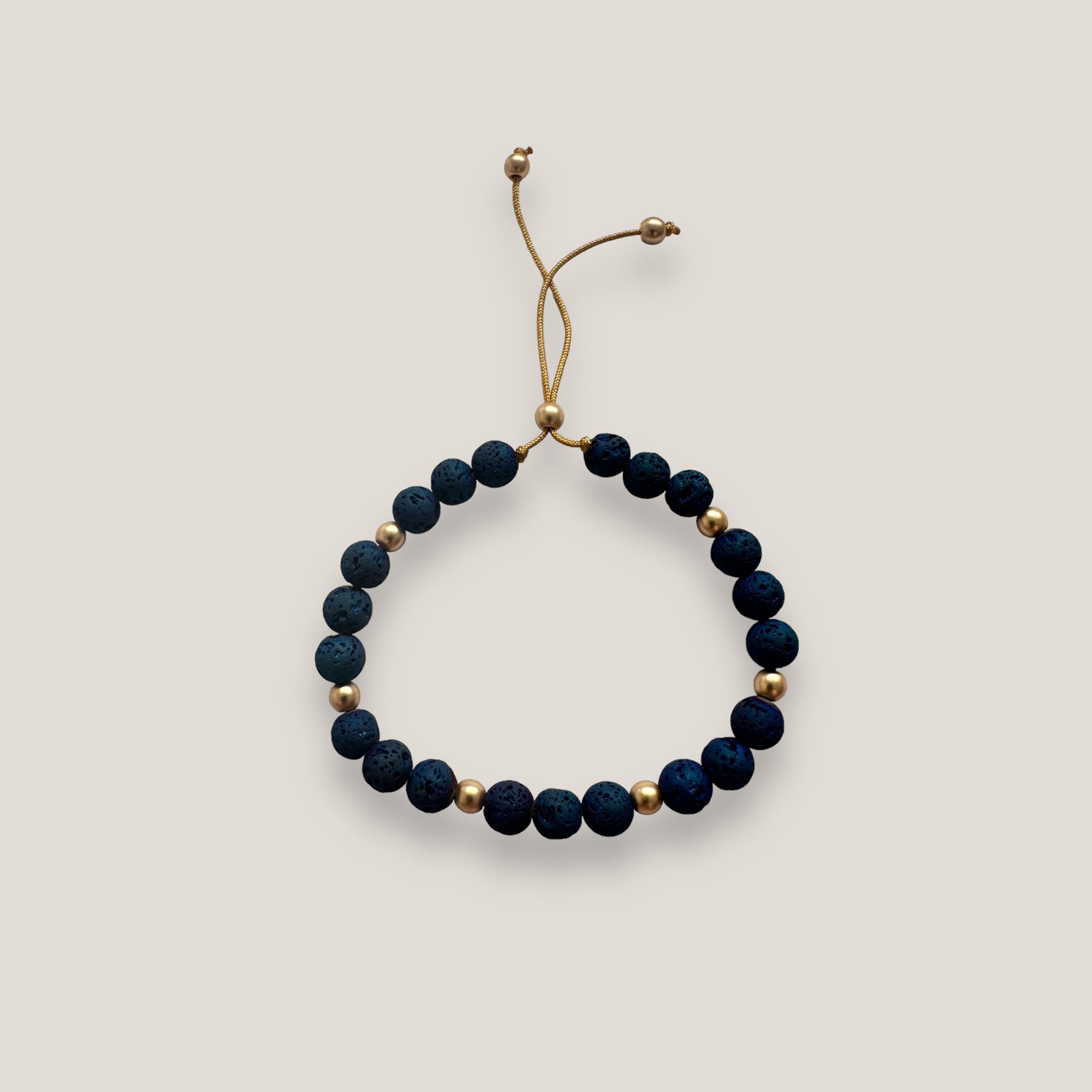 Pulsera Tirma piedra dorada y lava azul añil