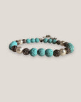Pulsera Dafne perlas con lava turquesa y filigrana gunmetal con cristalitos