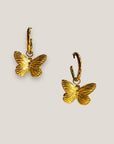 Pendientes aro clic con colgante mariposa acero oro