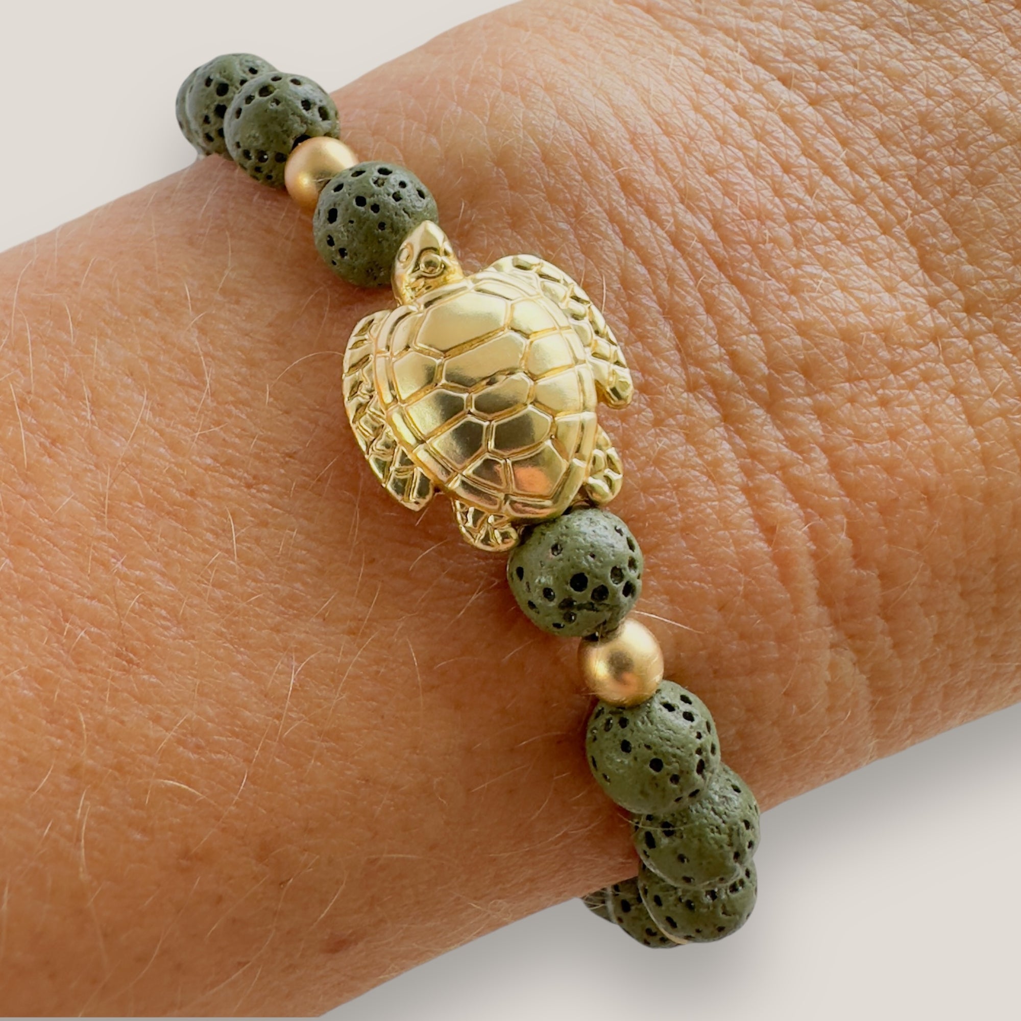 Bracelet with large golden turtle and colored lava