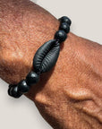 Pulsera cowrie negra mate ónix facetado pulido