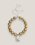 Collar gran caracola turbante nácar beis dorado cuentas madera pan de oro
