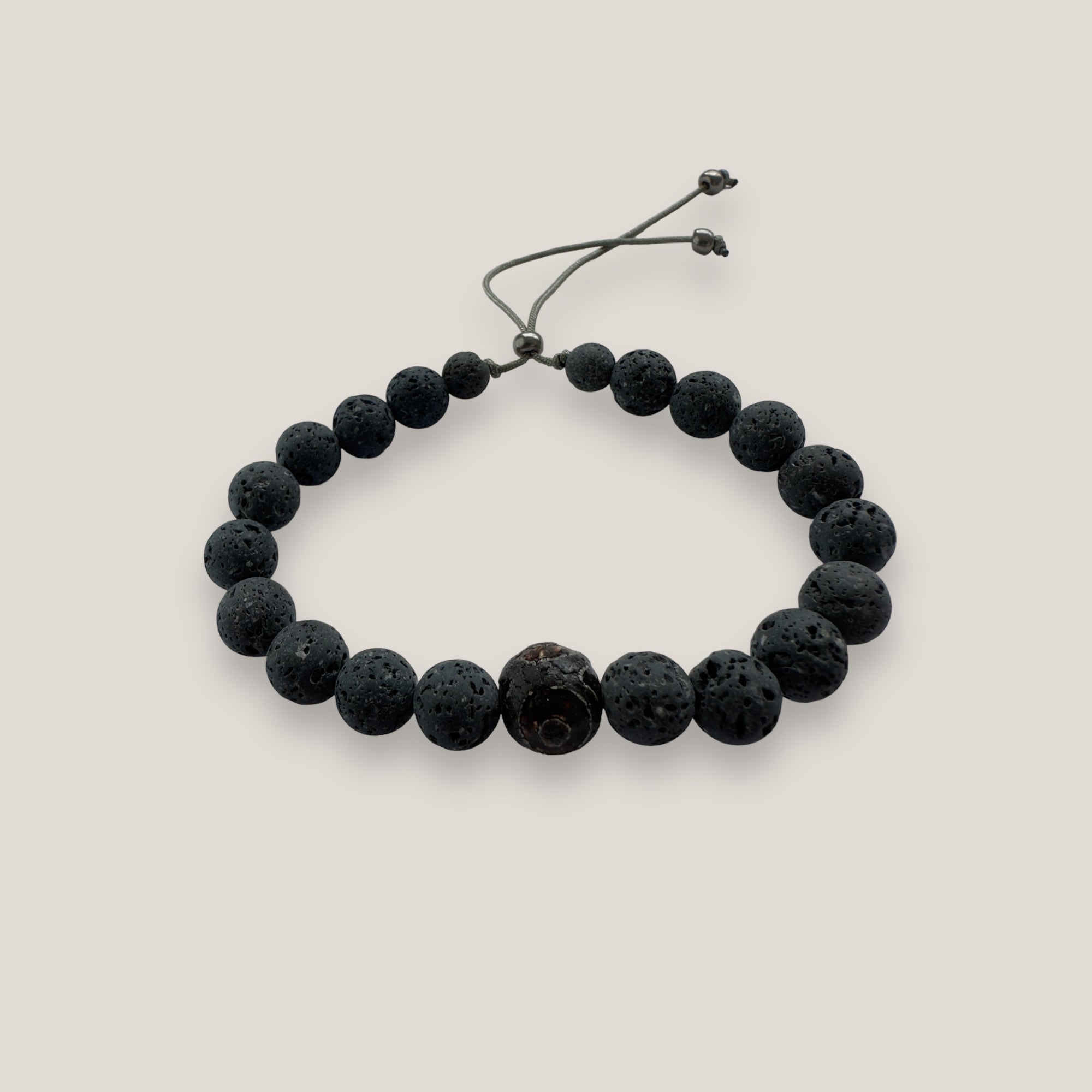 Pulsera con ojo de la suerte aborigen y lava gris oscuro
