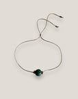 Pulsera minimal con bola 8mm de lava verde oscuro y separadores gunmetal con cristalitos blancos