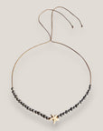 Collar Eloise con estrella howlita blanca, lava y hematitas facetadas gris metalizadas