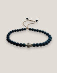 Pulsera con tortuguita plateada y lava azul añil