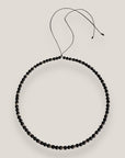 Collar mini base 4mm lava negra, rondeles plateados con cristalitos blancos