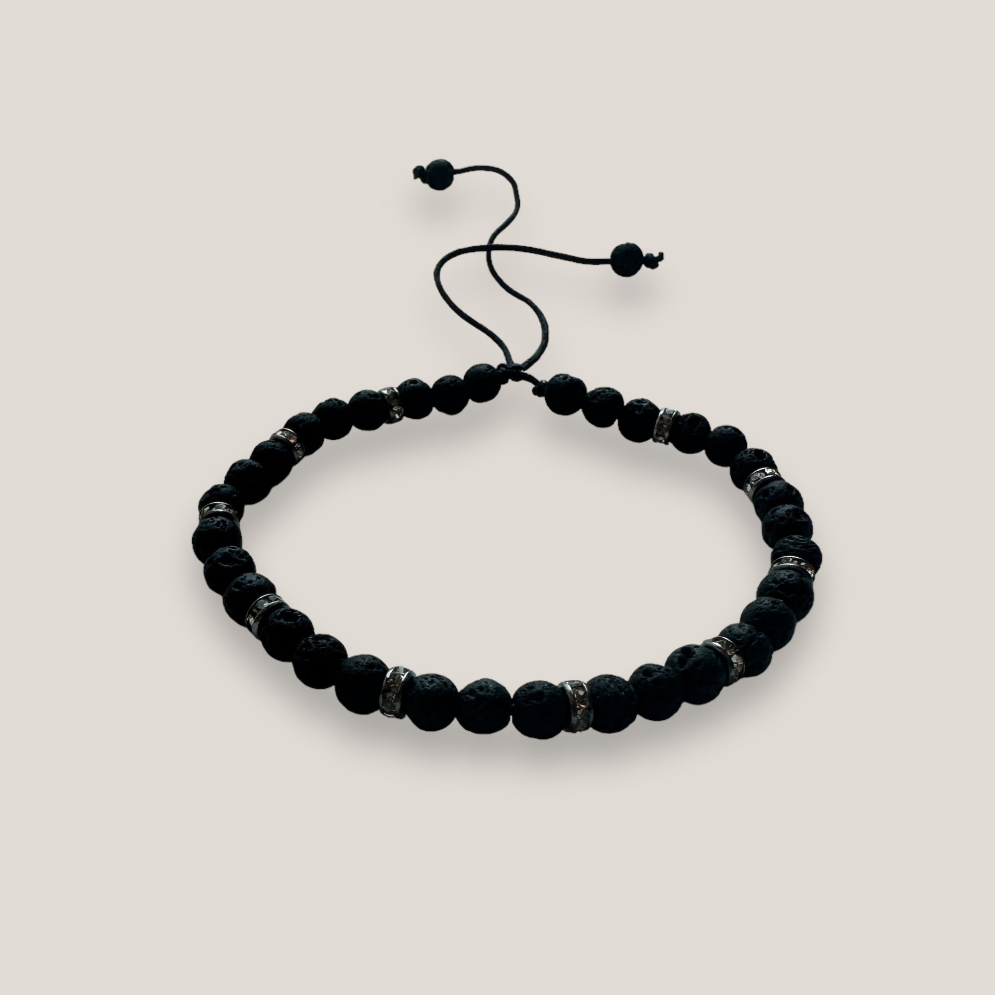 Pulsera Lilith con cuentas 4mm de lava negra y brillis gunmetal con cristalitos blancos