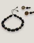 Pendientes Dafne gancho y medalla aguas con separador acero oro, lava negra y cuentas con filigrana bronce con cristalitos