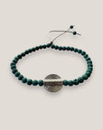 Pulsera pieza círculos concéntricos plateada con lava verde oscuro