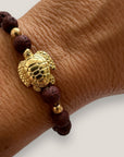 Bracelet with large golden turtle and colored lava