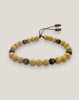 Pulsera Dafne con esponja coral amarillo claro y filigrana bronce con cristalitos