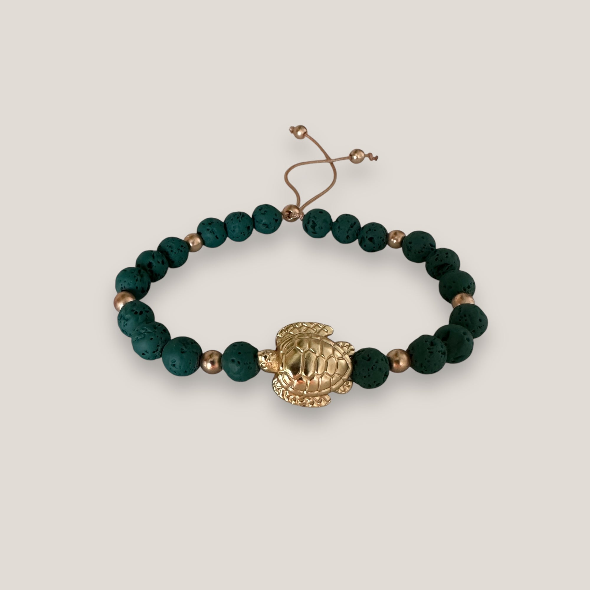 Bracelet with large golden turtle and colored lava