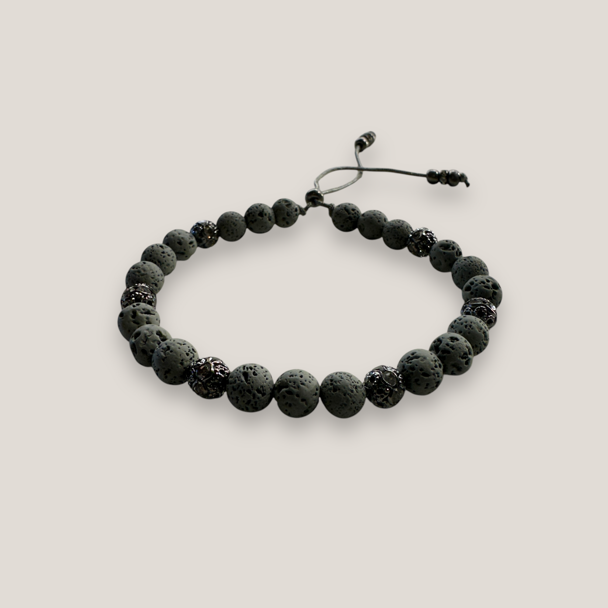 Pulsera Dafne con lava gris claro y filigrana gunmetal con cristalitos