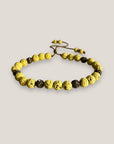 Pulsera Dafne con lava amarillo claro y filigrana bronce con cristalitos