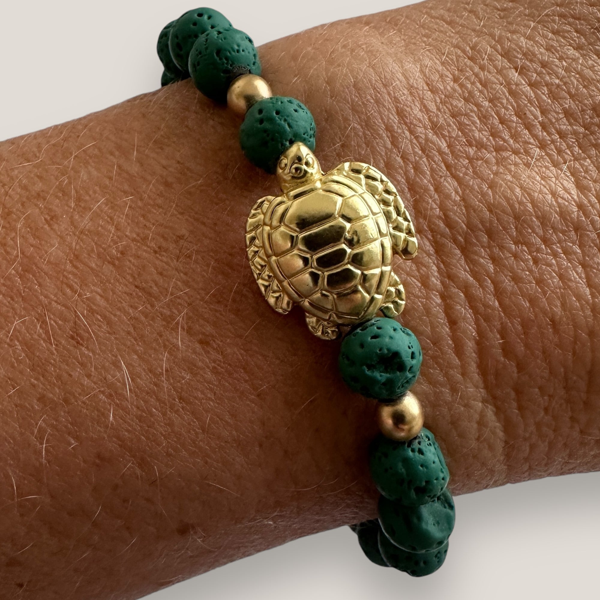 Bracelet with large golden turtle and colored lava