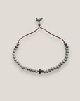 Pulsera con tortuguita plateada y lava blanca