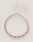 Collar con tubos y cuentas de lava rosa y brillis oro con cristalitos rosas