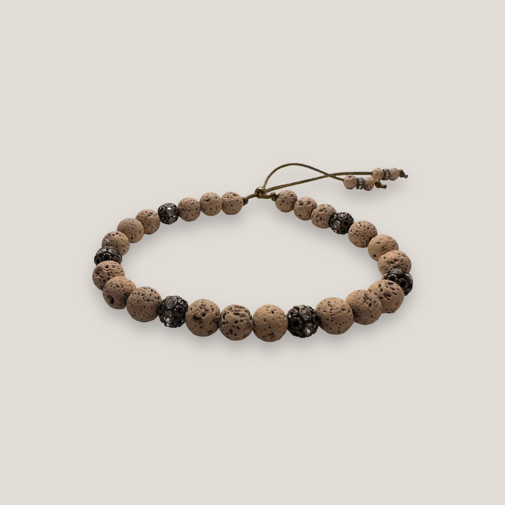 Pulsera Dafne con lava arena y filigrana bronce con cristalitos