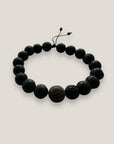 Pulsera base con gran ojo aborigen de la suerte y lava negra